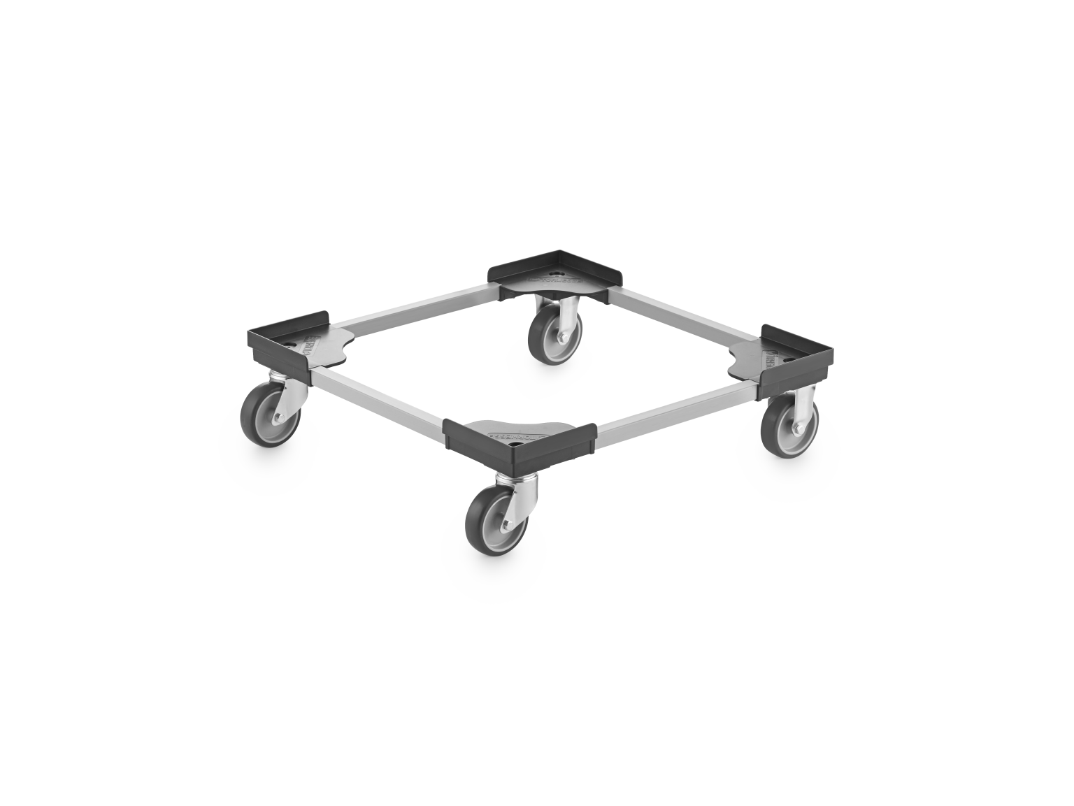 A transport dolly with a rectangular frame, featuring four swivel wheels. The frame is metallic, with black plastic corner pieces, and is designed for moving heavy objects easily in industrial settings.