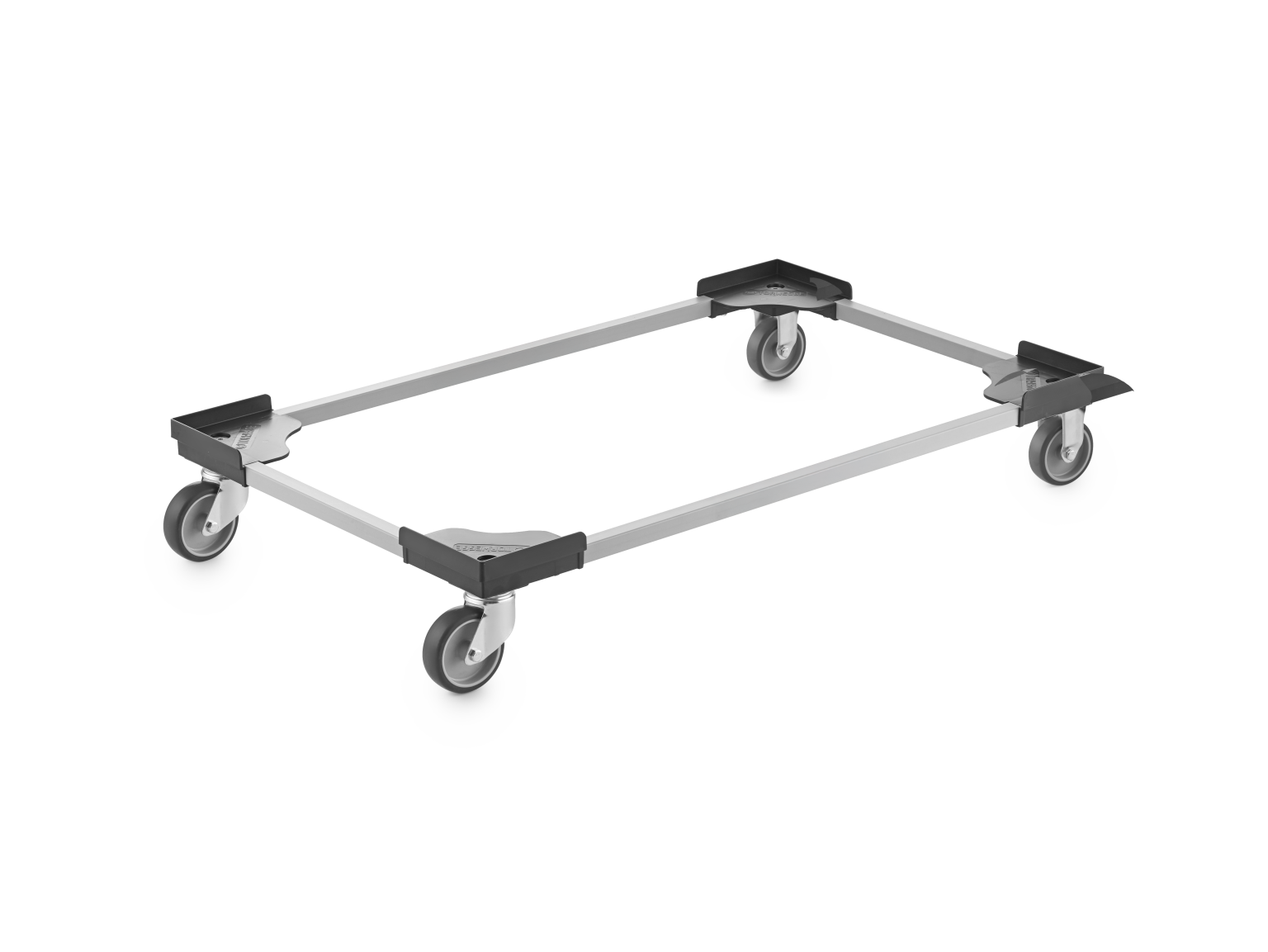A rectangular transport dolly features four swivel wheels at each corner, connected by a metal frame. It is designed for easy movement of heavy loads in an industrial setting.